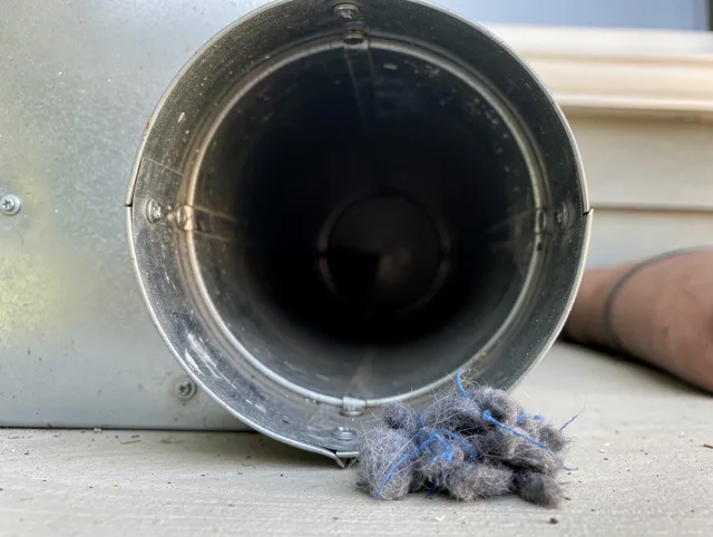 Cromwell Dryer Vent Cleaning technician using specialized equipment to clear severe dryer vent blockage in Cromwell